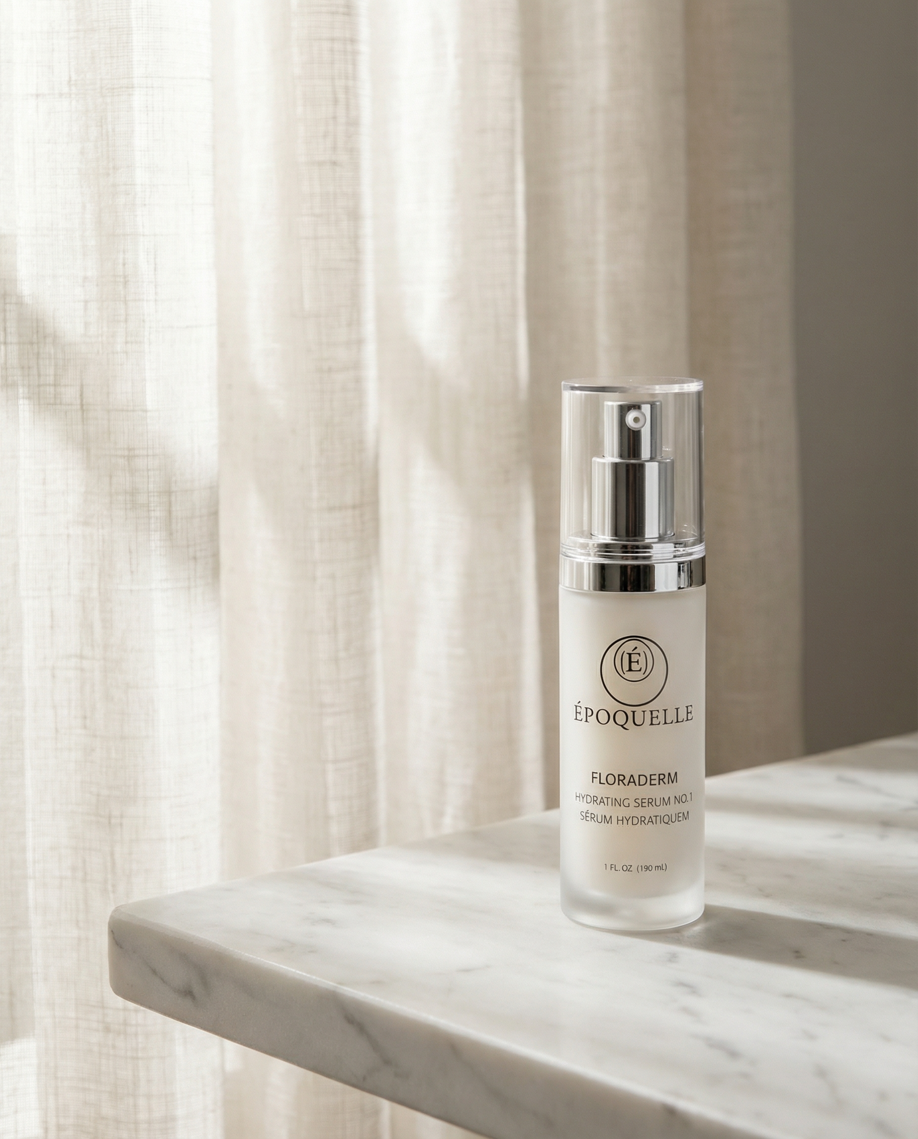 Époquelle Floraderm Hydratique serum bottle on white marble with soft natural light